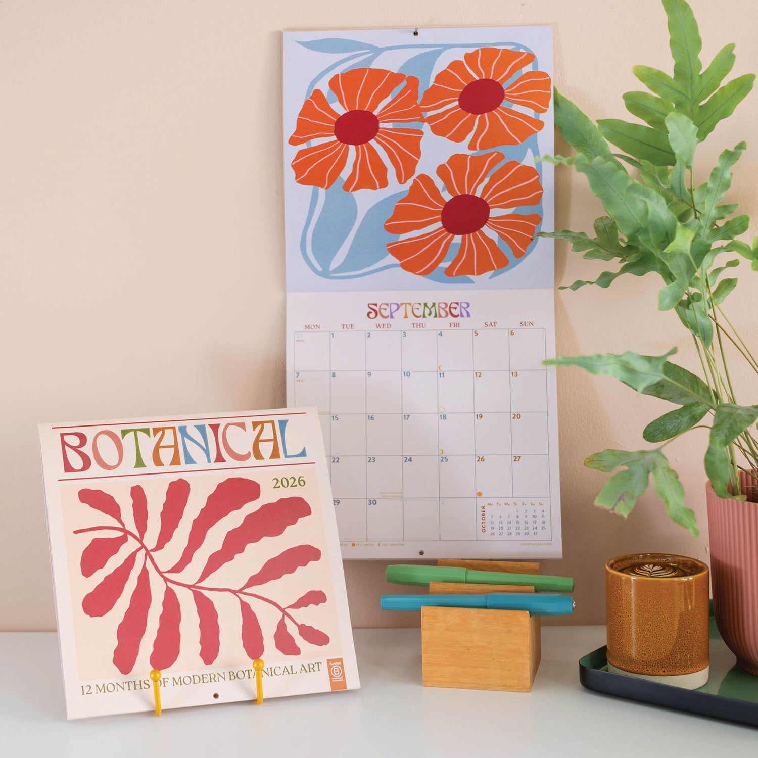Botanical Flower Wall Calendar 2026 featuring 12 months of floral illustrations, moon phases, holidays, and planning details, perfect for desk or office décor
