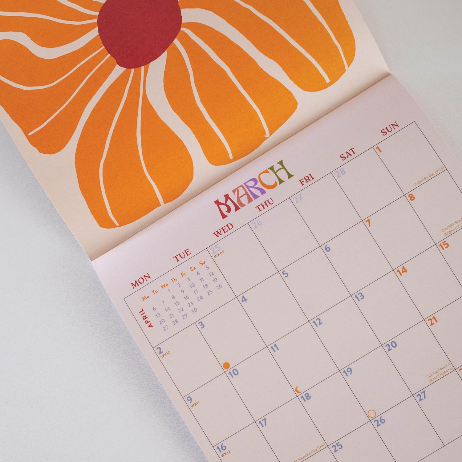 Calendar open to March with a floral design on the cover