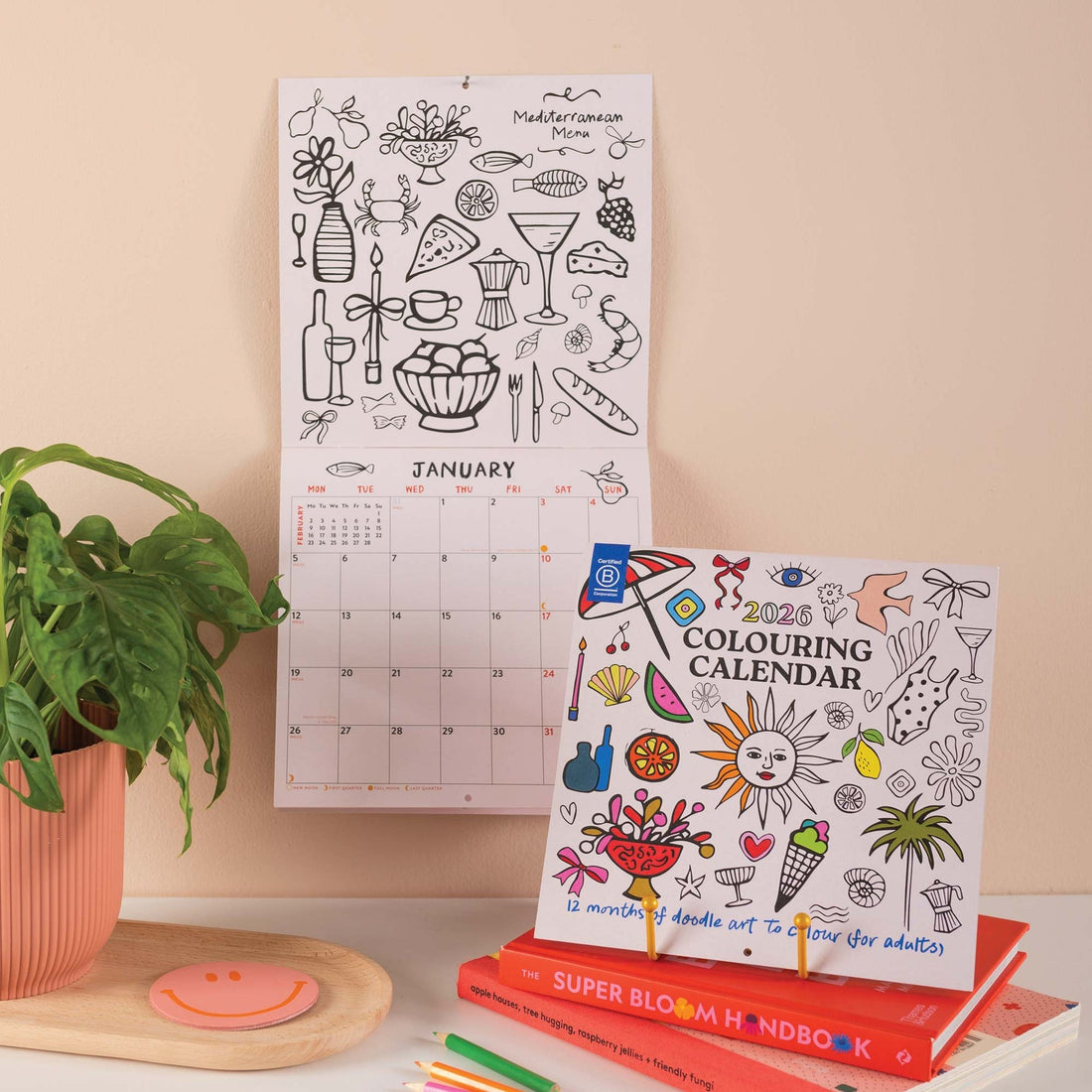 2026 colouring wall calendar with month-to-view layout and illustrations to colour