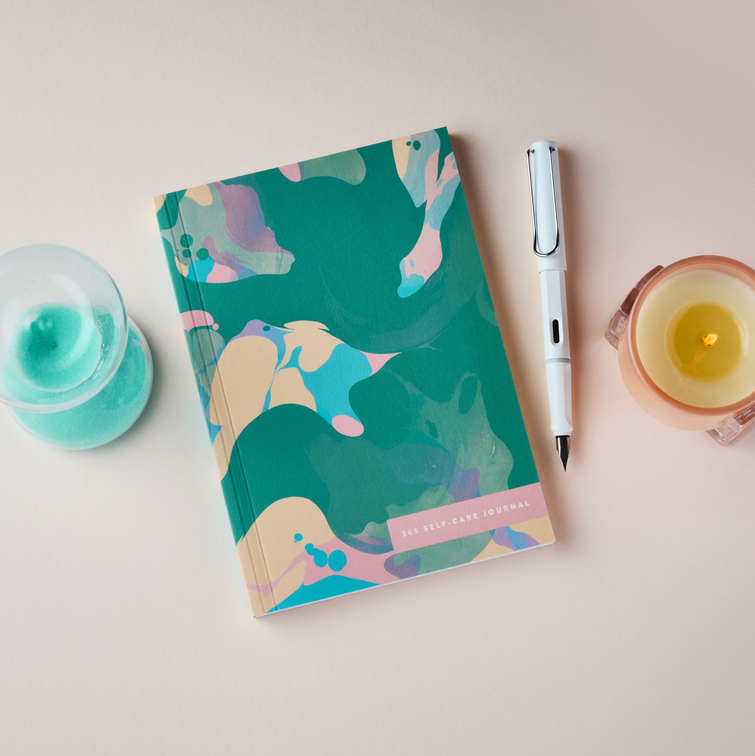 365 Self Care Journal teal marble with a pen, and candle on a light surface