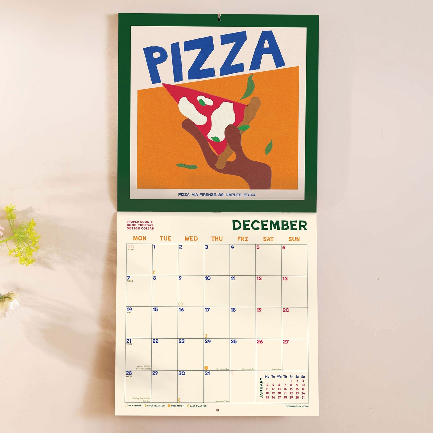 Calendar with a pizza design on a light background