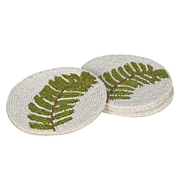 Set of round coasters with leaf design on a white background