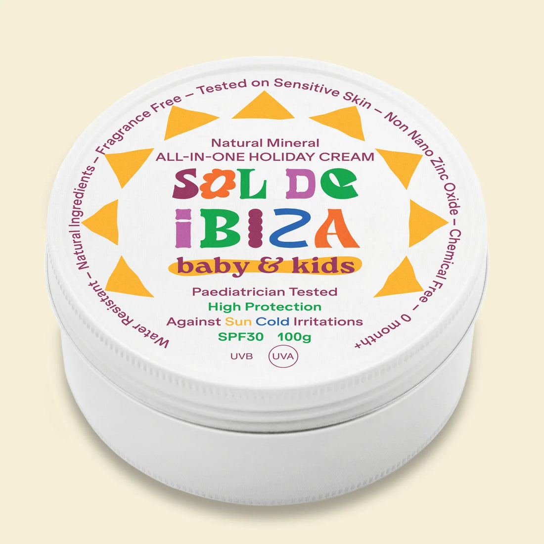 Sal de Ibiza baby & kids cream in a tin with colorful label on a beige background