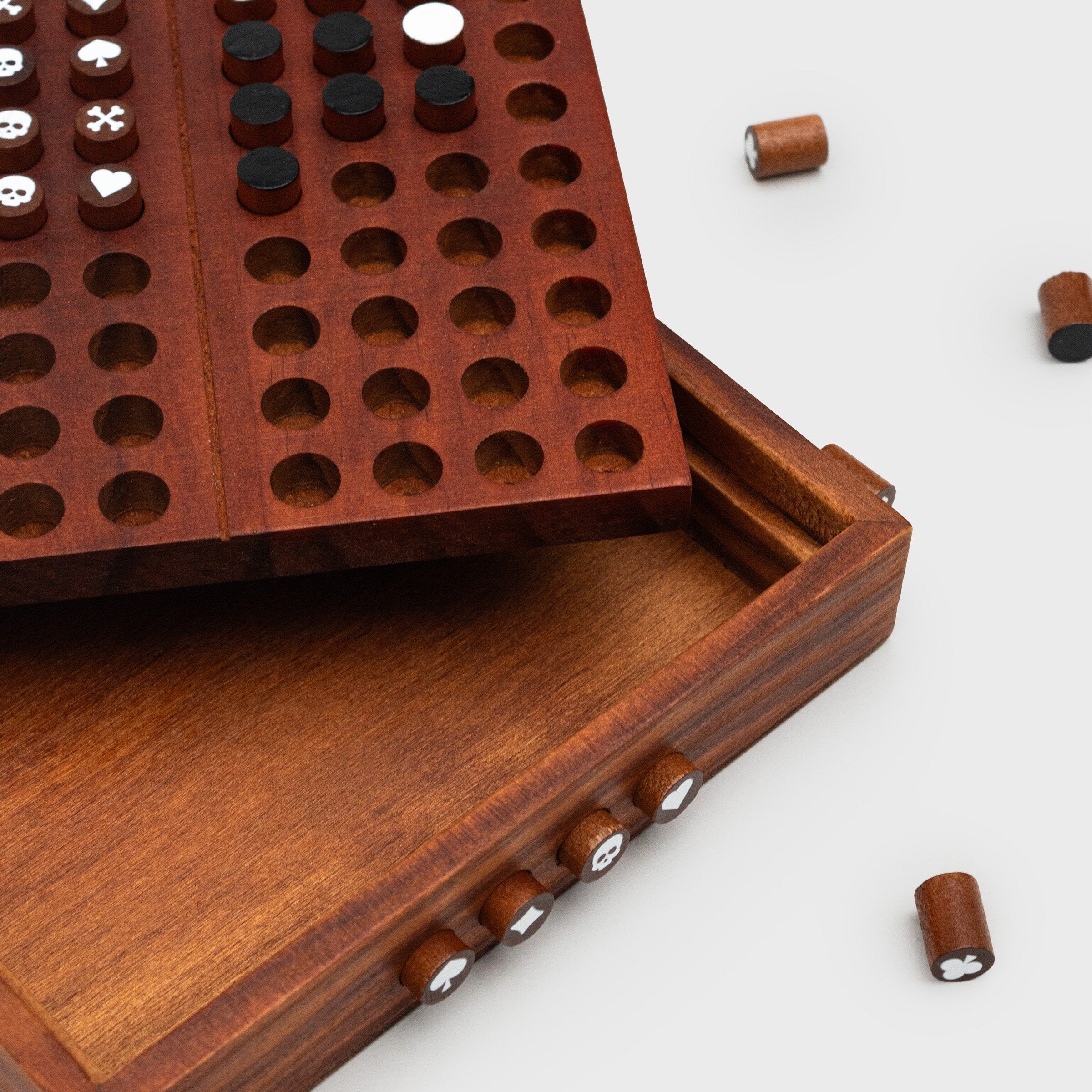 Close-up of Codebreaker wooden game with coded pegs