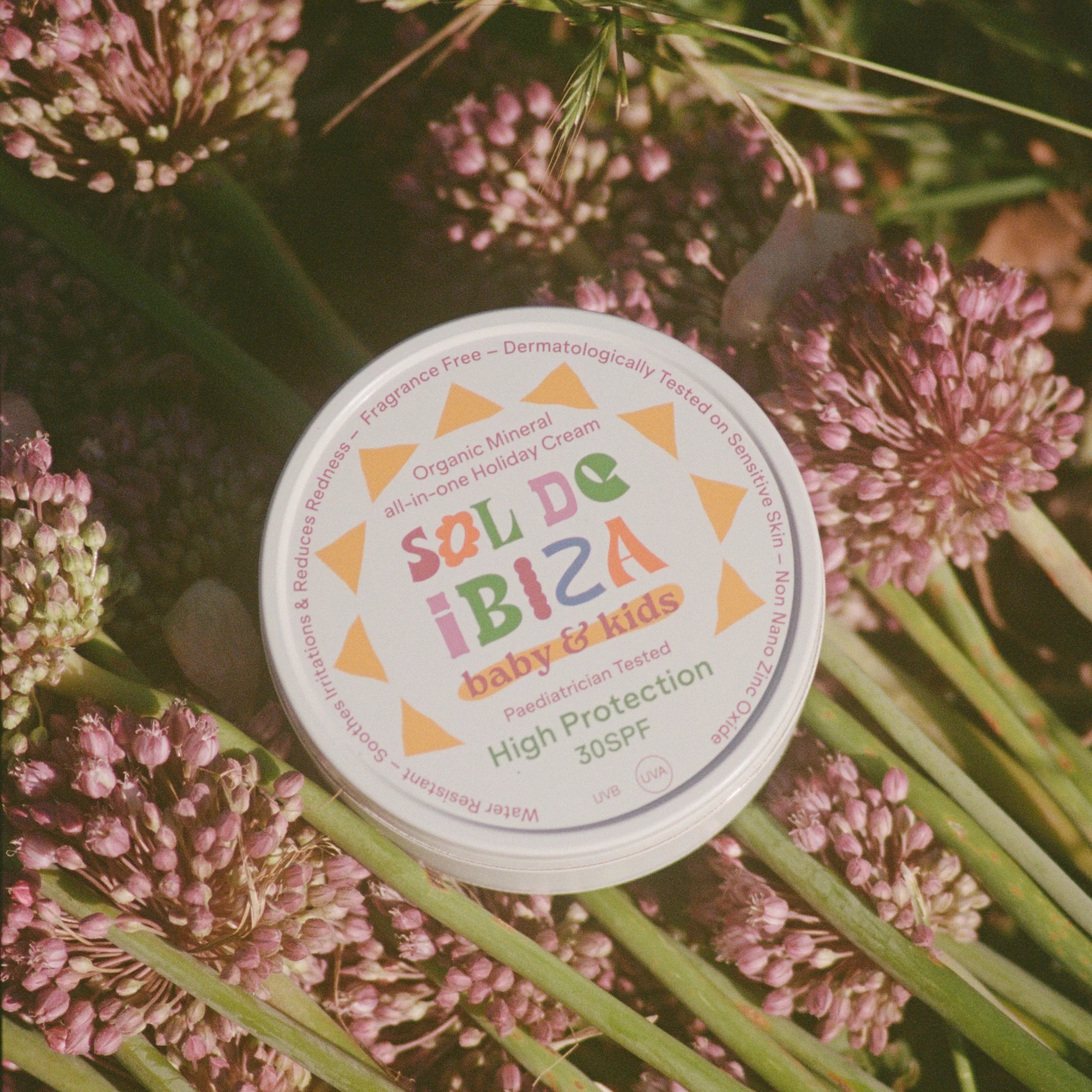 Sunscreen cream tin labeled &