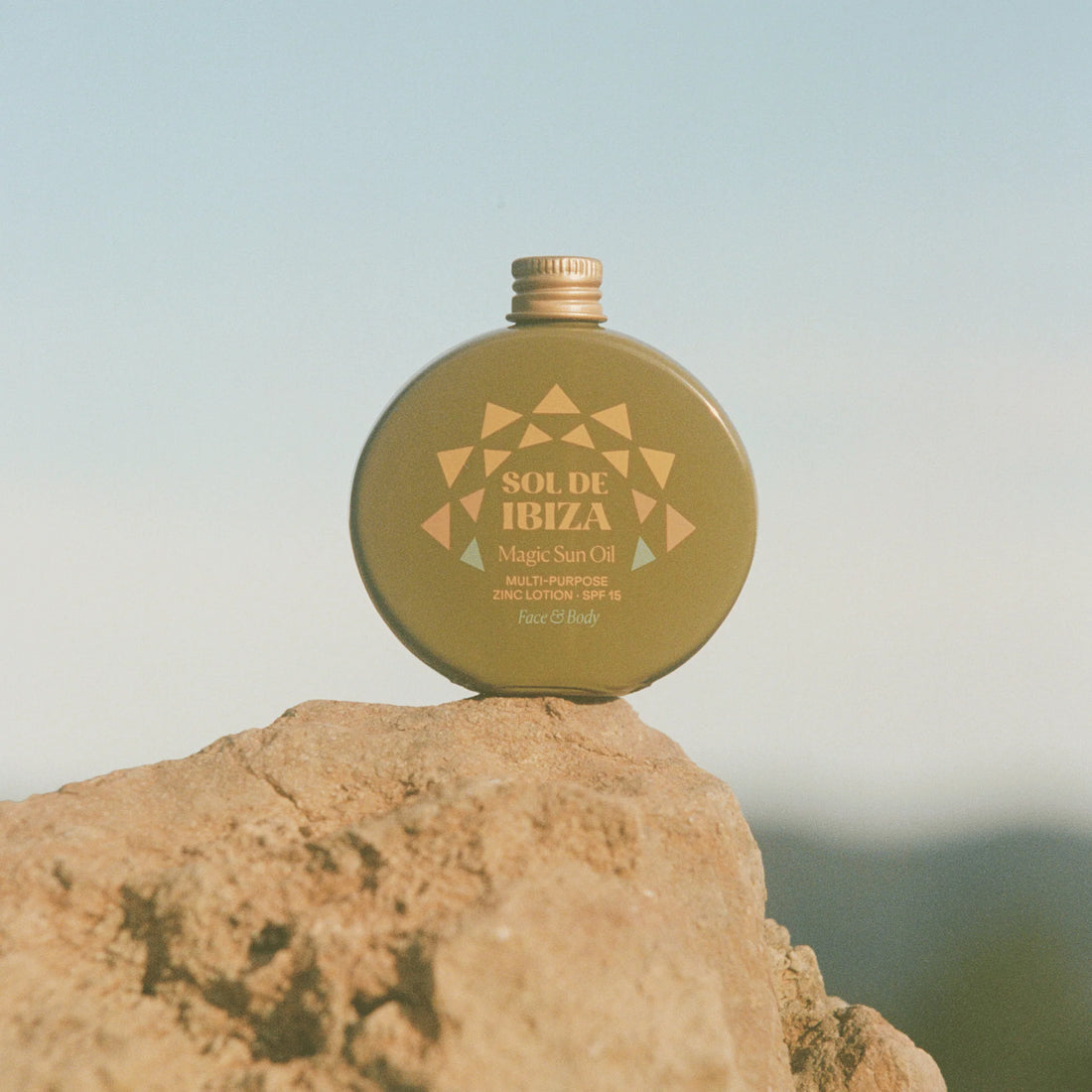 Sol de Ibiza Magic Sun Oil SPF15 – natural vegan sunscreen on a rock