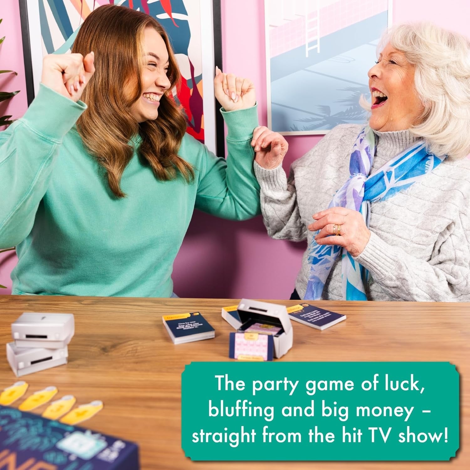 Two players of different ages winning the Fortune Hotel board game, competing in mini-challenges and swapping briefcases.