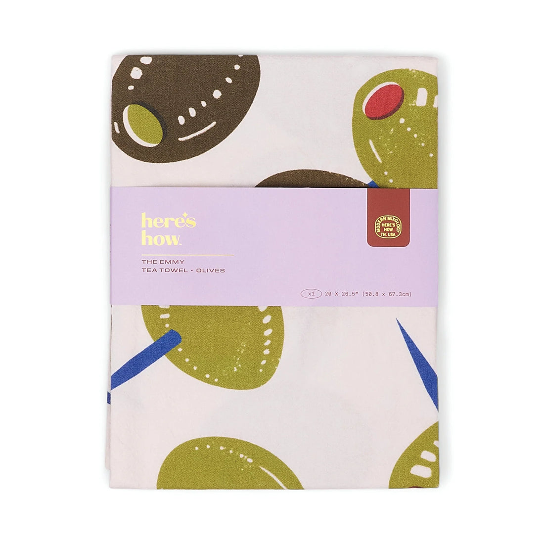 Tea towel with olive design packaging on a white background