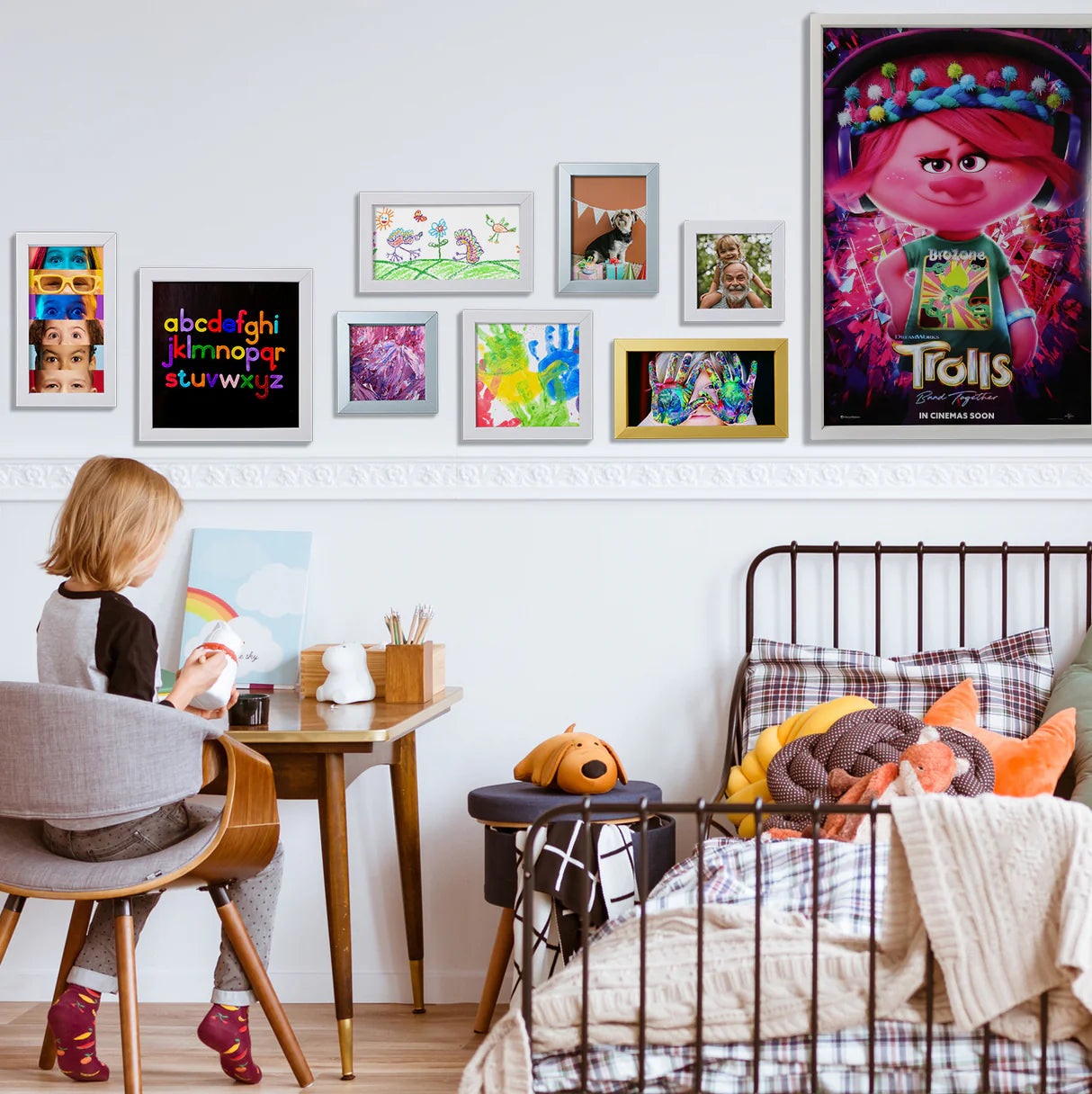 Wall display showing multiple medium Customizable Frame Kits in different sizes, each featuring framed artwork or custom pictures.