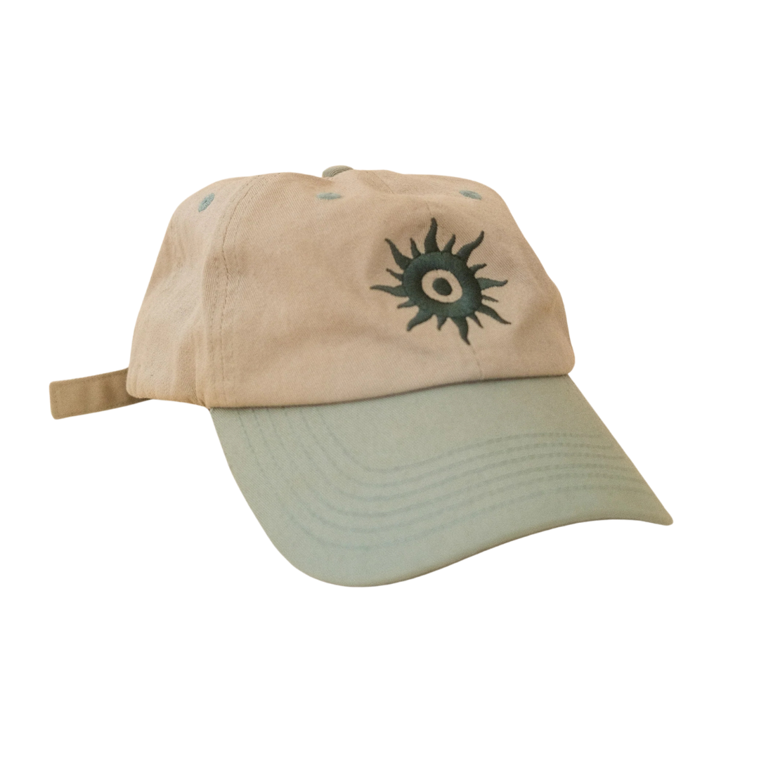 Beige & Sage cotton cap with green embroidered Daystar design on the front, shown against a white background