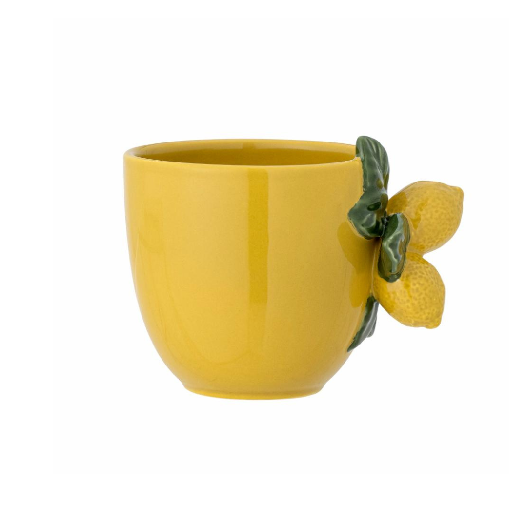 Yellow stoneware cup with hand-painted lemon design and sculpted lemon branch handle. Mediterranean-inspired ceramic mug.