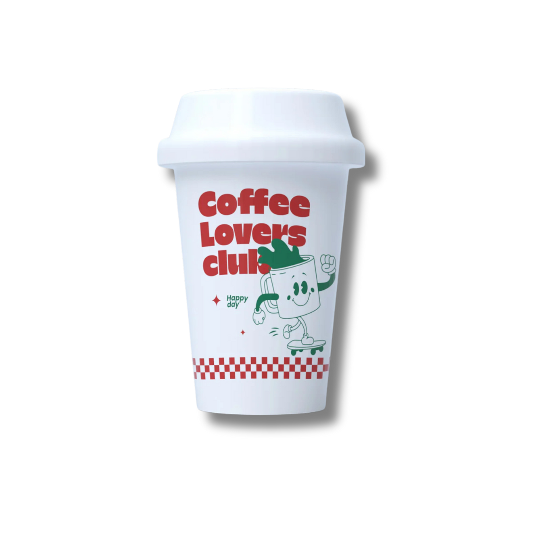 A white ceramic cup with a red and green graphic that includes a coffee mug and the text &