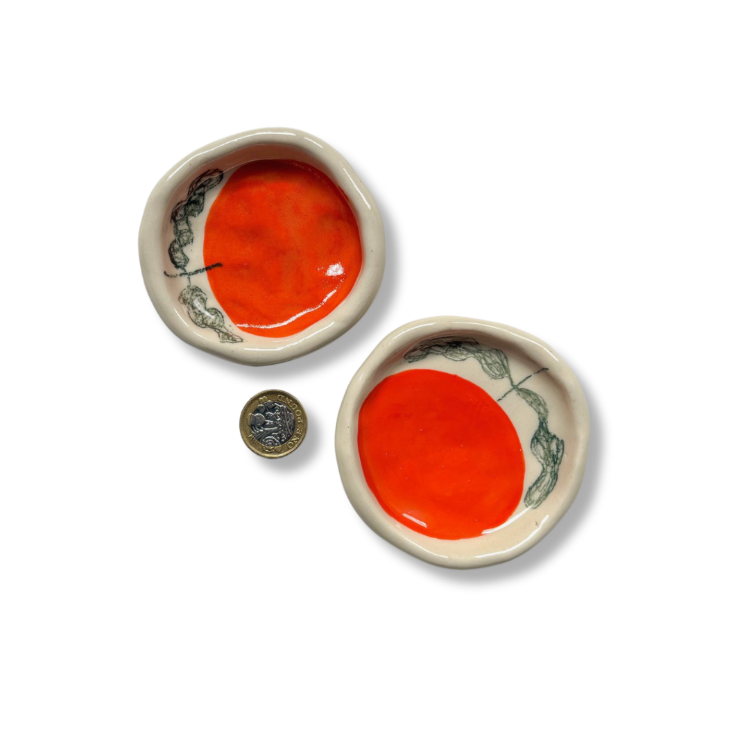 Small hand-painted stoneware trinket dish with vibrant orange motif