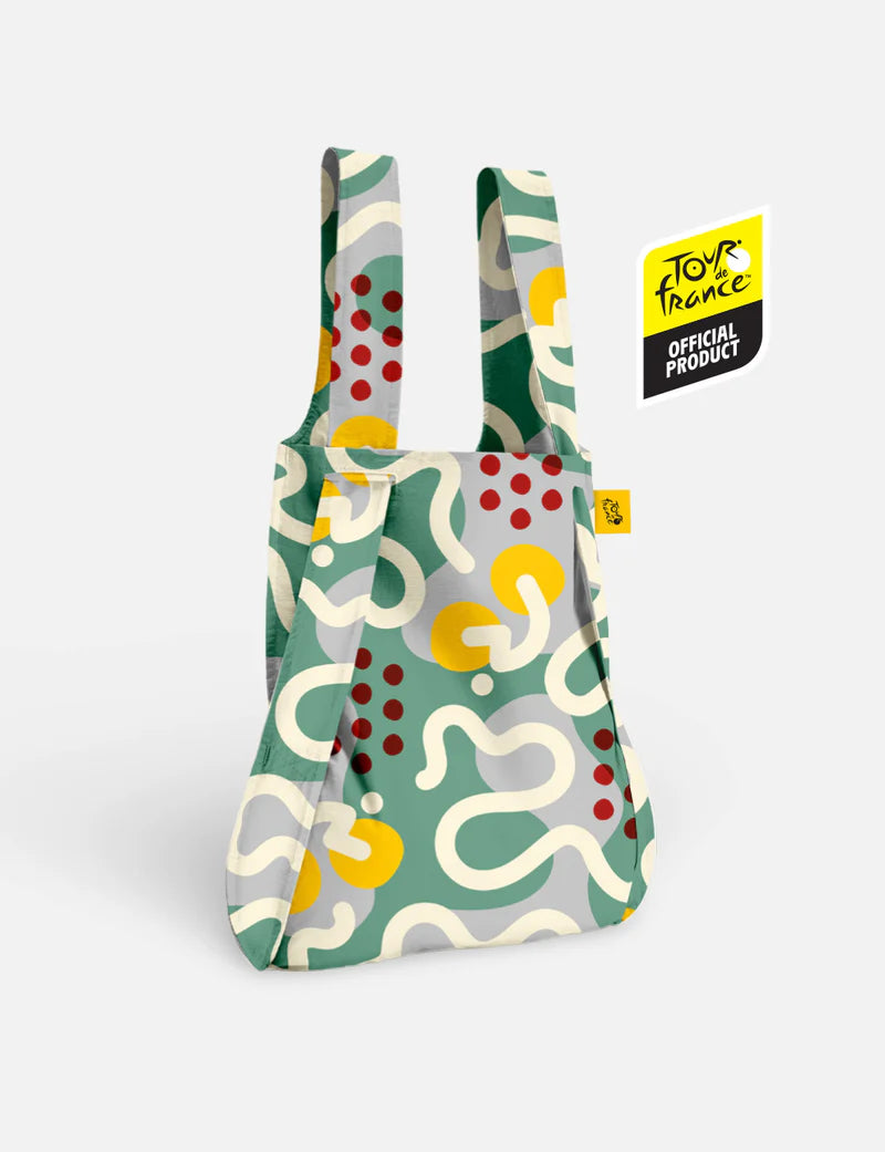 Reusable shopping bag with colorful abstract pattern on a white background