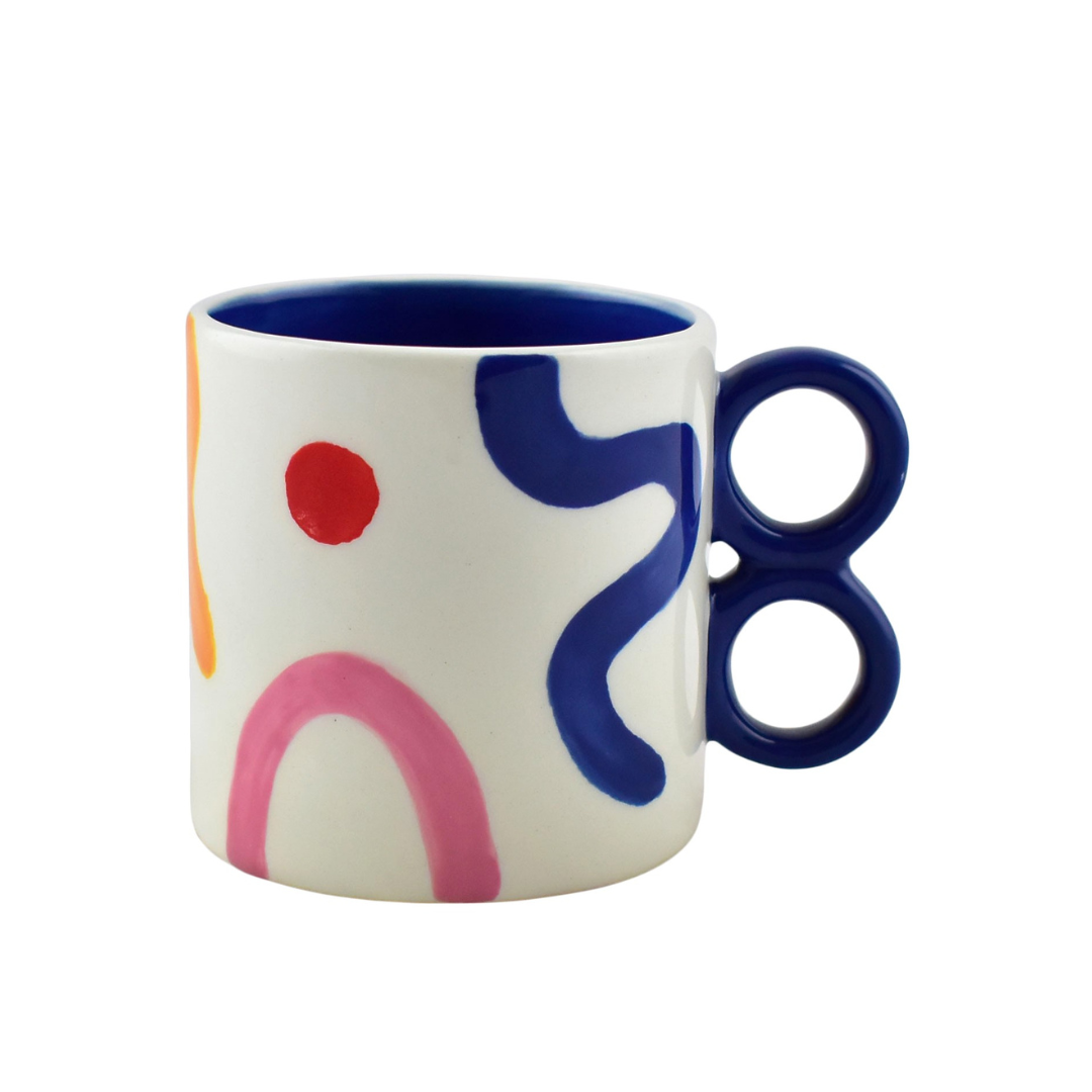 Sara Pintura Locura with Hand-painted abstract modern pattern on ceramic mug in blue, red, pink, and orange