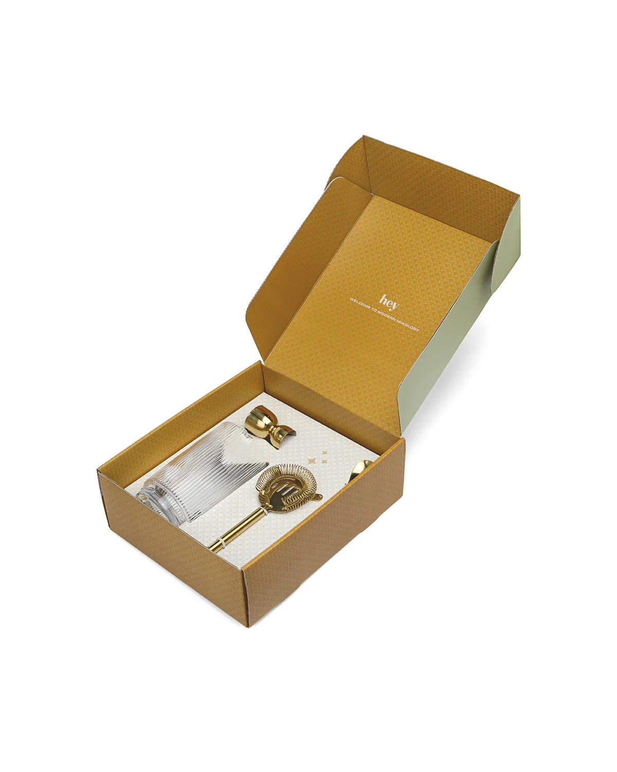 Renley Gold Cocktail Bar Set with glass beaker, gold stainless steel strainer, jigger, and cocktail spoon in a elegant box