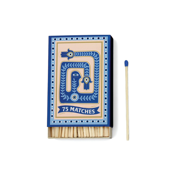 Decorative matchbox with mystical eye design, labeled seventy-five matches, with blue-tipped matchstick