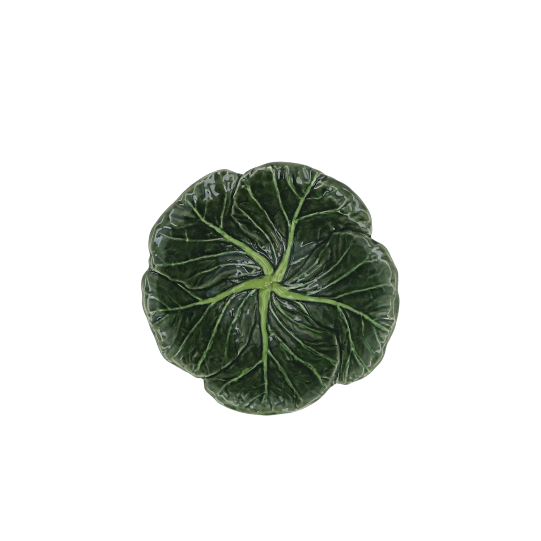 A green stoneware bowl designed to resemble a cabbage leaf.