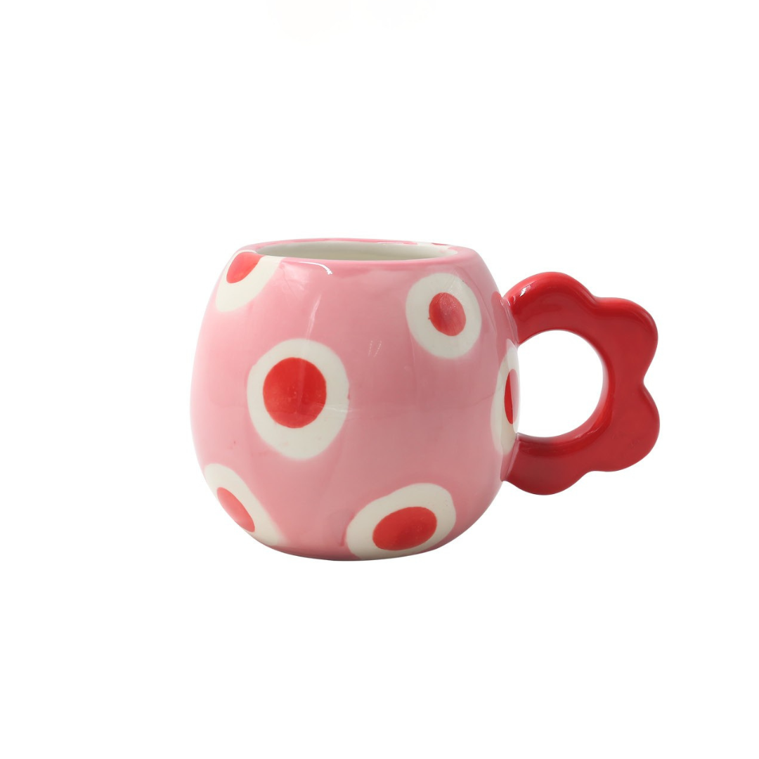 Juanit Pink mug with red dots and a red ear-shaped handle