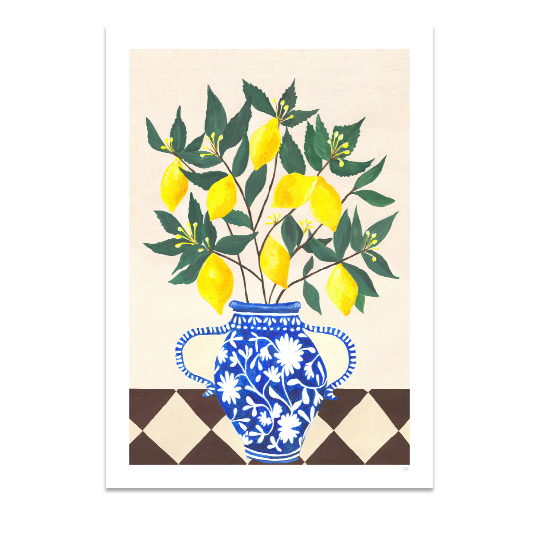 Decorative print with a blue and white floral vase holding lemons and green leaves on a beige background.