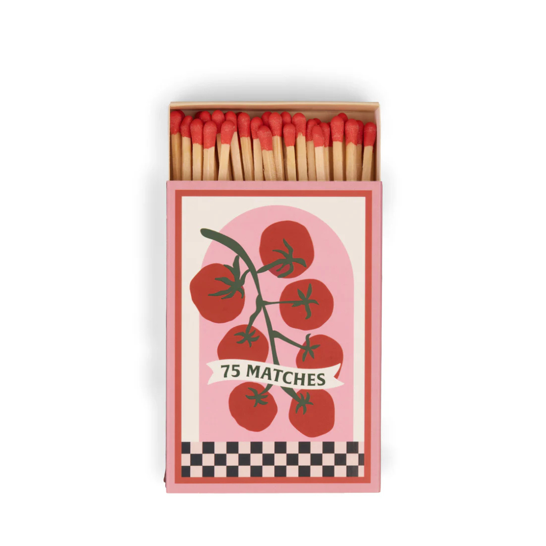 Decorative matchbox with tomato design, labeled seventy-five matches, with red-tipped matchstick