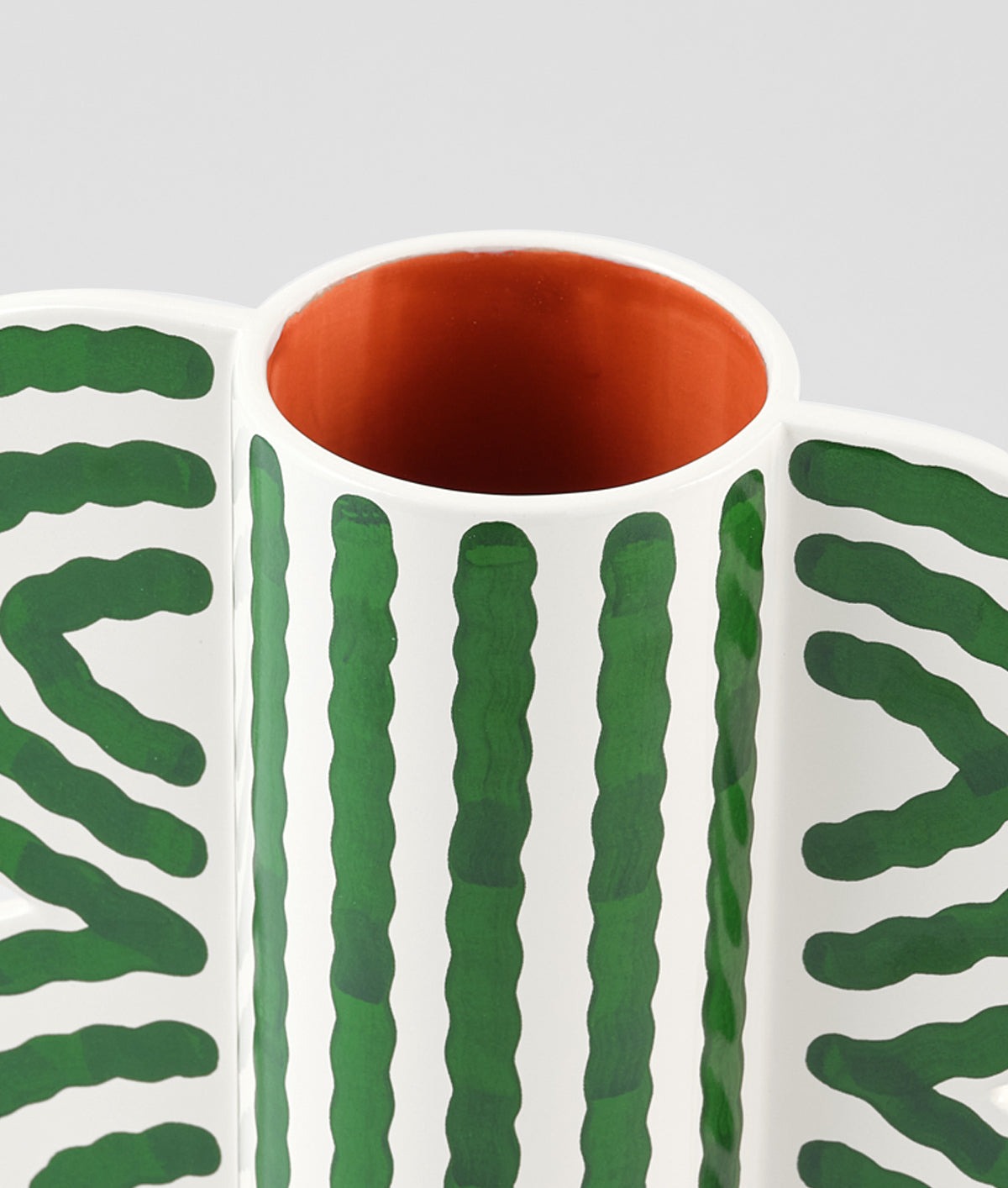 Close-up of the Butterfly Vase opening – off-white ceramic with smooth rim and green wave pattern detailing
