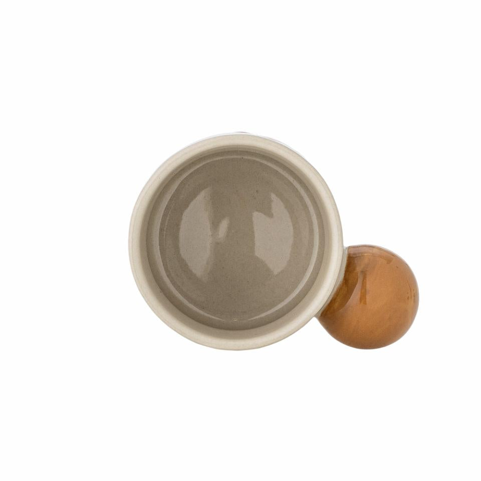 Stoneware cup with round handle on a white background