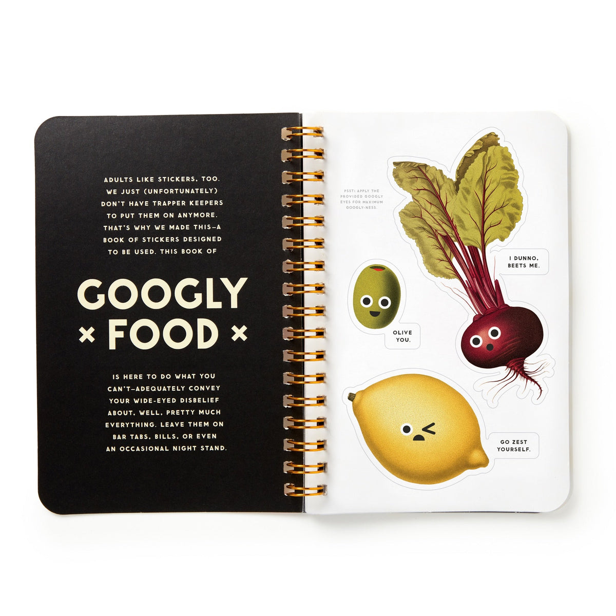 Open notebook with black cover and white interior featuring illustrations of vegetables and text.