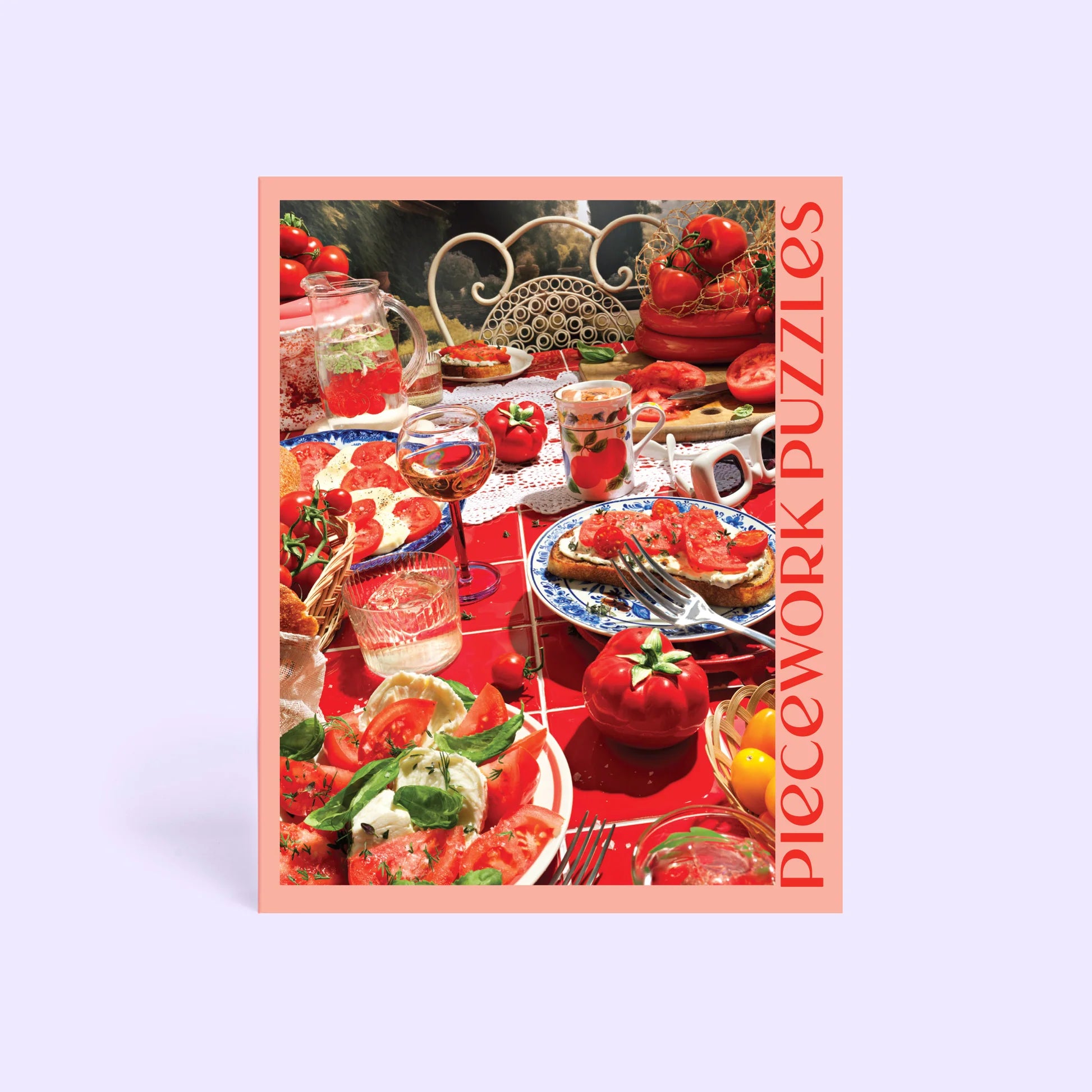 Jigsaw puzzle box with a table setting featuring tomatoes and other food items on a red tablecloth.