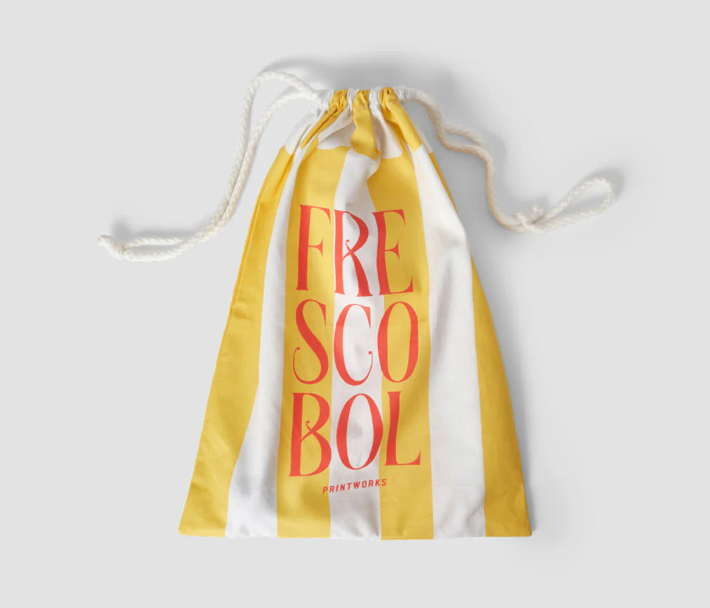 Yellow and white striped cloth bag with Frescobol Paddle Set – includes two wooden rackets and one colored ball, stylish and portable for beach or outdoor play.