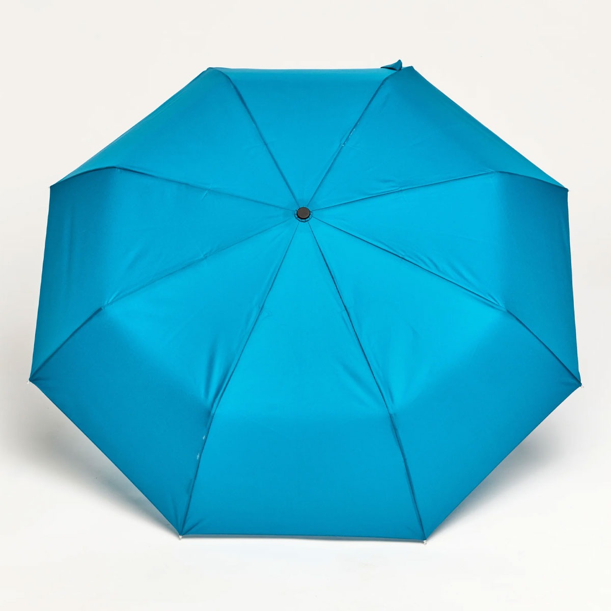 view of the Teal Compact Duck umbrella open. Made with recycled plastic canopy, birch wooden handle, lightweight and wind-resistant design for city and travel use