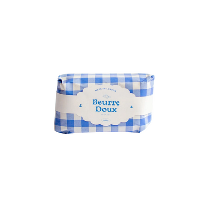 Butter Candle with blue and white checkered wrapper and &