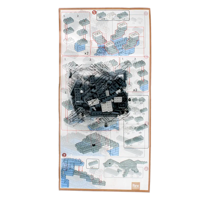 Model building kit for the Grey Diplodocus Rex Dinosaur Brick Building Kit with green blocks and instructions on a white background