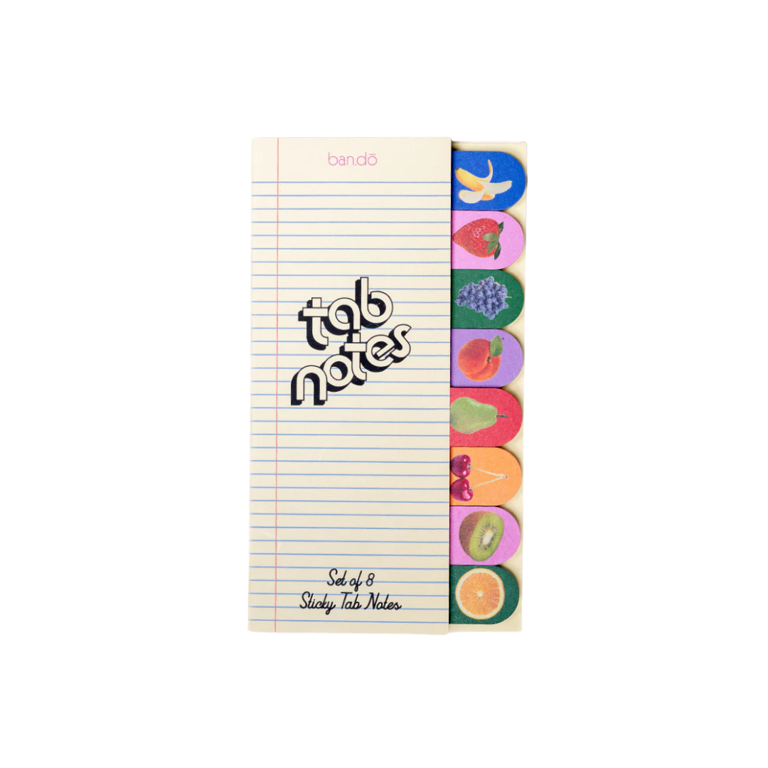 Notebook with colorful fruit tab stickers on a white background