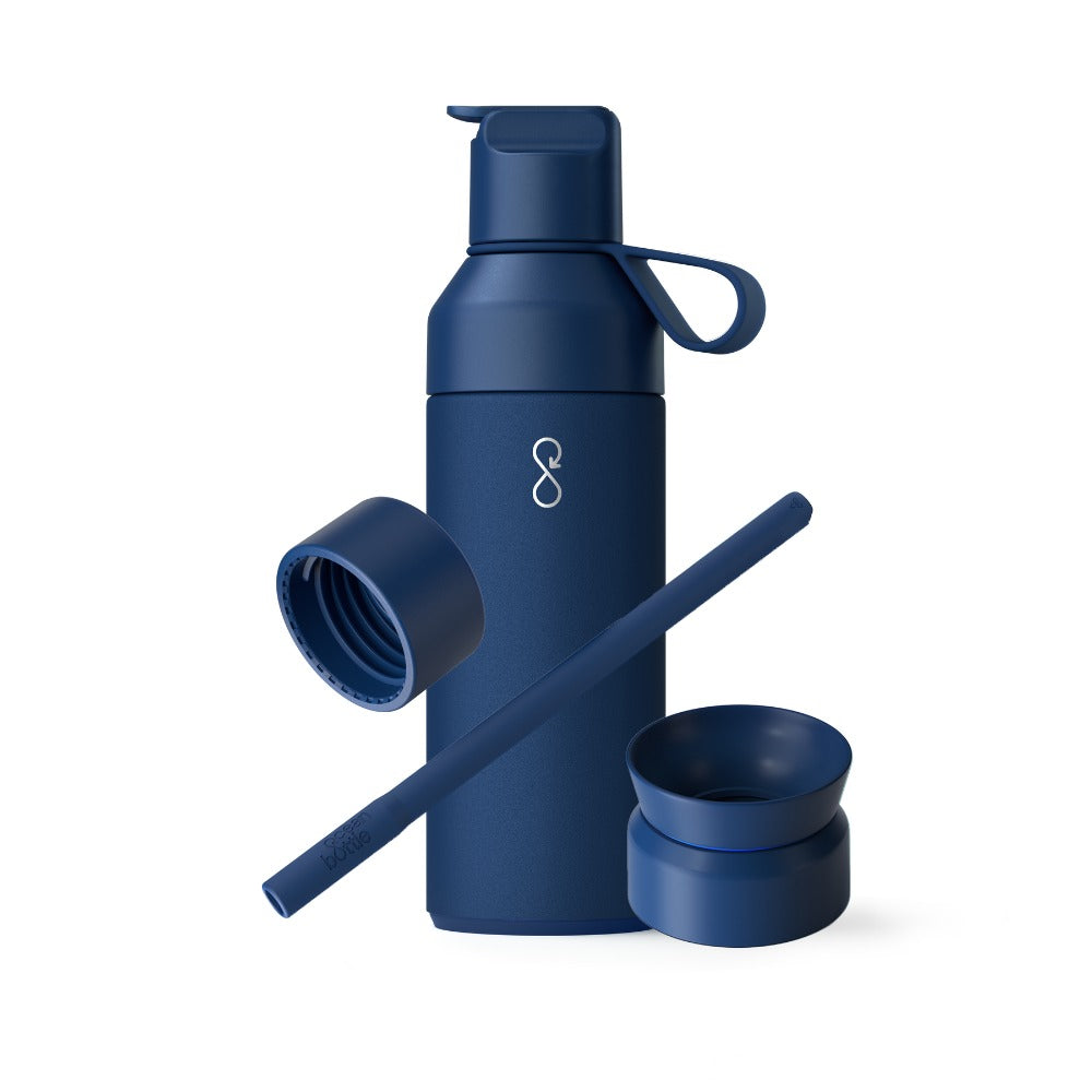 A blue Ocean Bottle 500ml with three interchangeable lids and a straw, displayed against a white background.