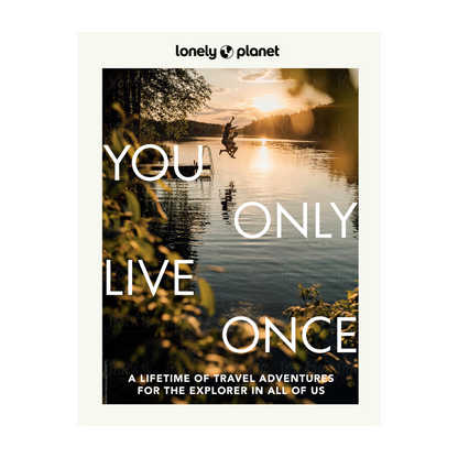 Lonely Planet travel guide You live only oncer book cover with a person jumping into a lake at sunset.
