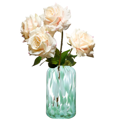 Contemporary green lava vase holding flowers on a white background