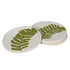 Set of round coasters with leaf design on a white background