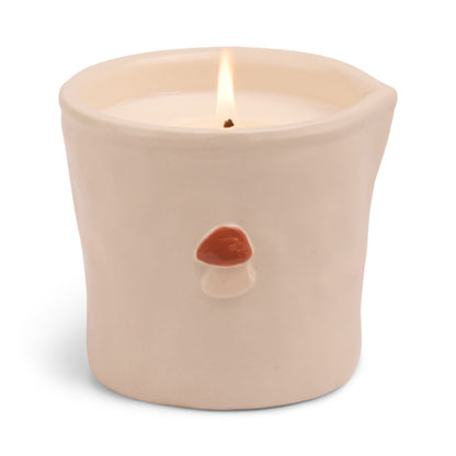 Ceramic candle holder with a mushroom design on a white background