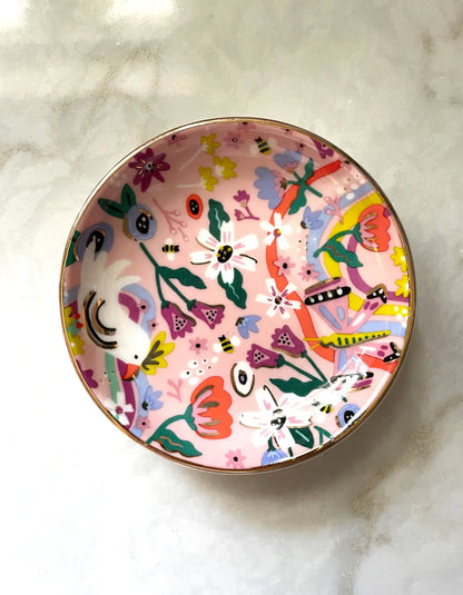 Butterfly garden  porcelain trinket dish with colorful floral and abstract designs on a marble surface