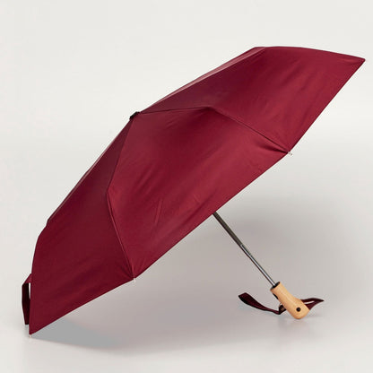 Side View of the Cherry Duck Compact Umbrella open – wind-resistant red canopy made from recycled plastic bottles with high-strength steel frame&quot;