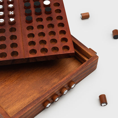 Close-up of Codebreaker wooden game with coded pegs