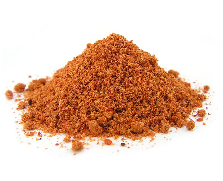 Pile of sri Lankan Curry powder on a white background