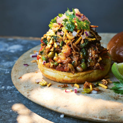 Open sandwich with curry powder on a stone surface with a dark background