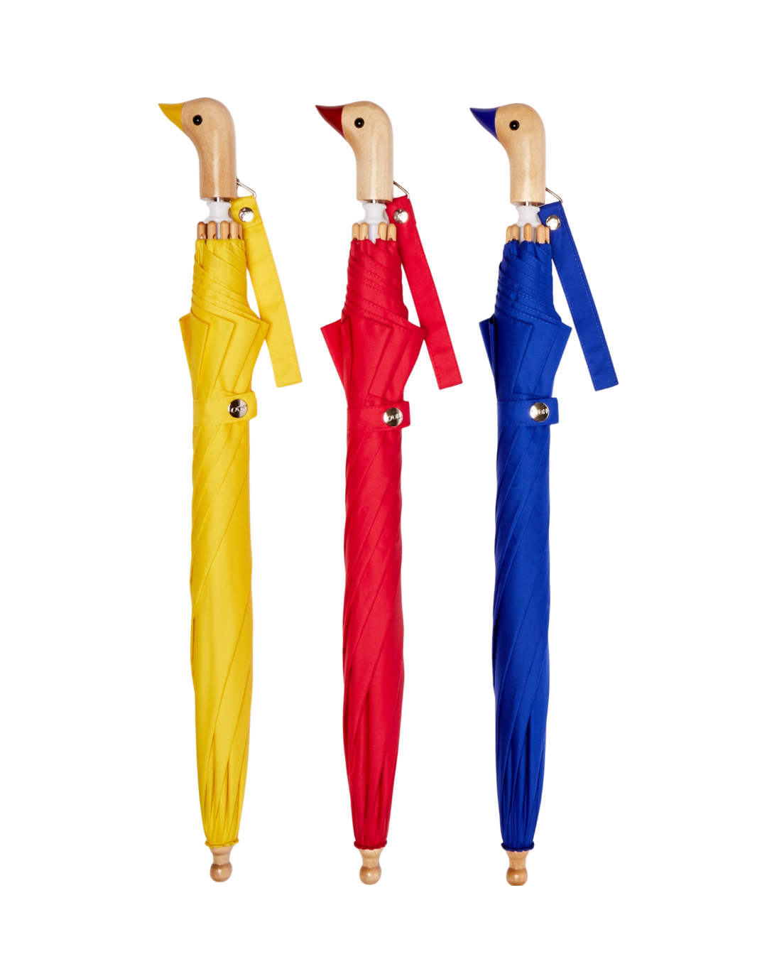 Three colorful umbrellas, yellow, red and blue shaped like ducks on a white background