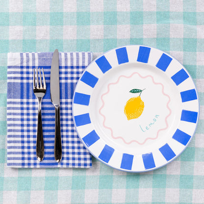 Lemon-themed enamel plate with blue stripes, pink wavy circle, and blue trim – 25cm, handcrafted and dishwasher safe