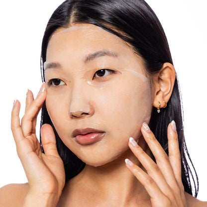 Woman wearing the ESW Beauty  Soothing Mask  on a white background