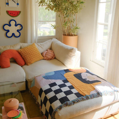 Cozy living room with a white sofa, colorful cushions, and Moretti Throw 