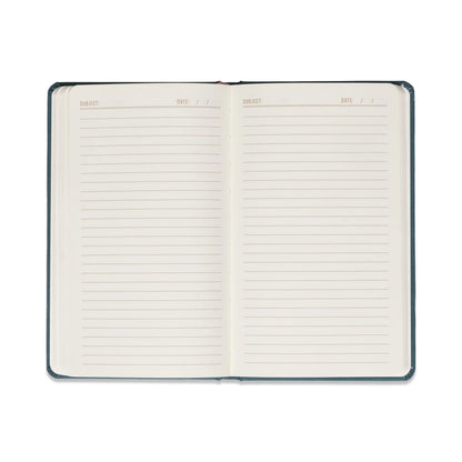 Open blue celestial journal showing lined pages on eco-friendly acid-free paper 