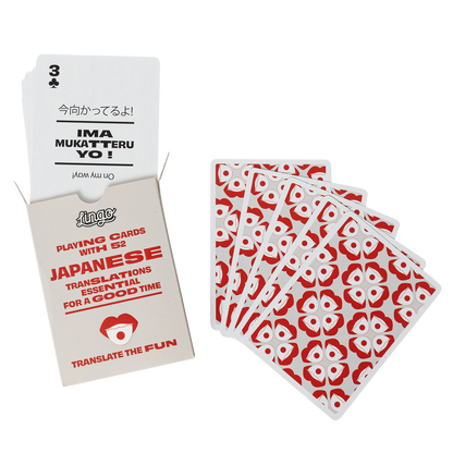 Playing cards with Japanese translations and a deck of cards on a white background